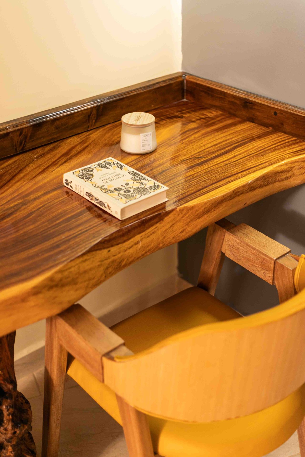 Solid wood desk with book in boutique room at Marahuaco Beach House Cartagena